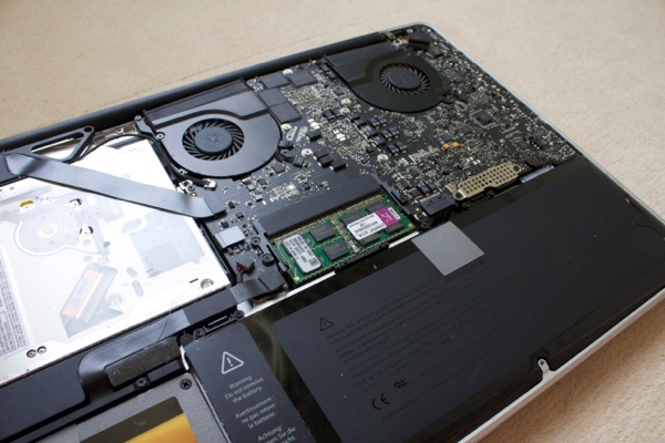 The internals of a MacBook Pro - the RAM is the green rectangle