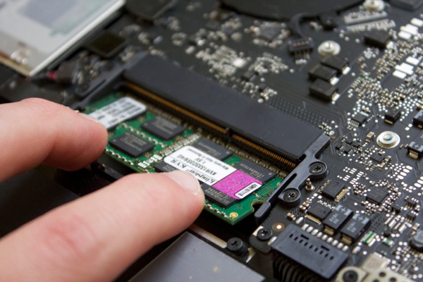 With two fingers, firmly push down until the module clicks in